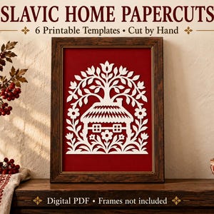 May include: A dark wood frame contains a white papercut design of a house beneath a tree on a red background. The text reads SLAVIC HOME PAPERCUTS, 6 Printable Templates, Cut by Hand, and Digital PDF, Frames not included.