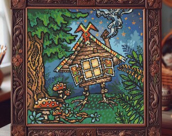 May include: A framed cross-stitch picture of a fantastical forest scene. It shows a small wooden house with a chimney, set amongst trees, mushrooms, and greenery. The frame is carved with floral and scroll patterns, giving it a rustic appearance. The artwork is in a wooden frame.