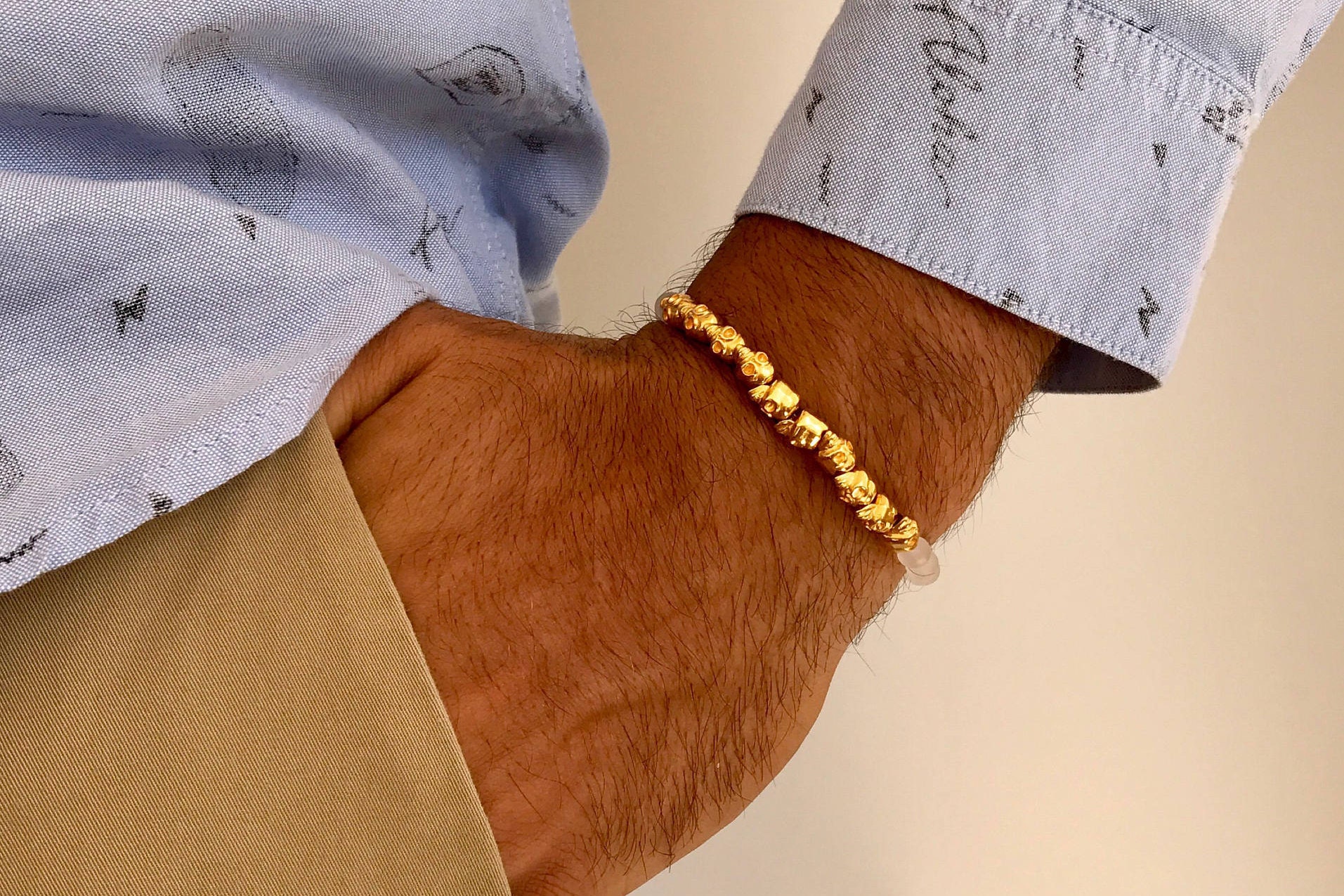 Mens gold skull best sale bracelet