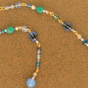 Marrakesh spectacle chain : Turquoise and sapphire beads on gold-plated links
