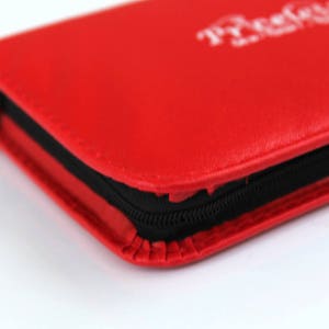 May include: A red leather zipped case with the word "ProCase" printed in white on the front.