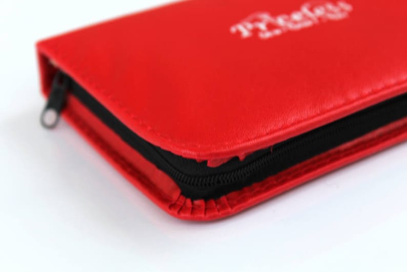 May include: A red leather zipped case with the word "ProCase" printed in white on the front.