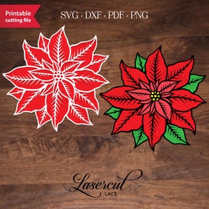 Puede incluir: Dos diseños de flores de poinsettia rojas, uno con contornos blancos y el otro con hojas verdes. Los diseños están sobre un fondo de madera con el texto "Lasercut Lace" en cursiva.