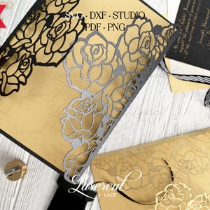 May include: Black laser cut rose design for a wedding invitation. The design is intricate and features a delicate floral pattern. The invitation is printed on gold cardstock.