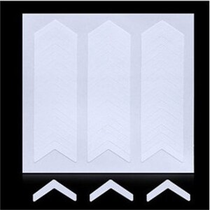 May include: Three white adhesive strips with a chevron pattern. Each strip has a pointed end and a rounded end. The strips are designed to be used for crafts, scrapbooking, or other projects.