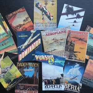May include: A collection of vintage travel posters featuring airplanes, zeppelins, and other modes of transportation. The posters are in various colors and feature text in different languages, including "Air France", "Dominator", "Pursuit", "Baden Baden", "Beria", and "Zeppelin".