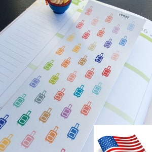 May include: A sheet of colorful luggage stickers with the text "PP542" and "USA SELLER". The stickers are in various colors, including red, orange, yellow, green, blue, purple, and pink. Each sticker features a simple outline of a suitcase.