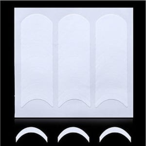 May include: A sheet of white nail guide stickers with a rounded shape. The stickers are arranged in three rows of 10 stickers each.
