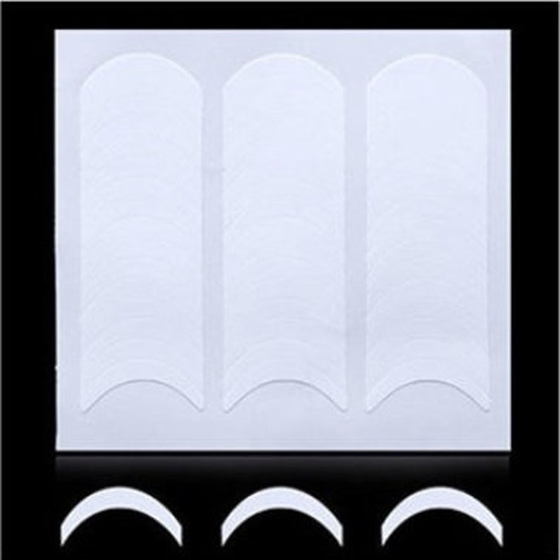 May include: A sheet of white nail guide stickers with a rounded shape. The stickers are arranged in three rows of 10 stickers each.