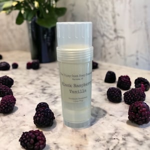 May include: A clear plastic deodorant stick with a black label that reads "The Tipsy Goat Soap Company, Warsaw, IN, Black Raspberry Vanilla, Handmade Deodorant, 2.5oz (70g)".