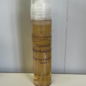 May include: A clear plastic bottle of Toasted Marshmallow Foaming Hand Soap by The Tipsy Goat Soap Company in Warsaw, IN. The bottle is 8.5 oz.
