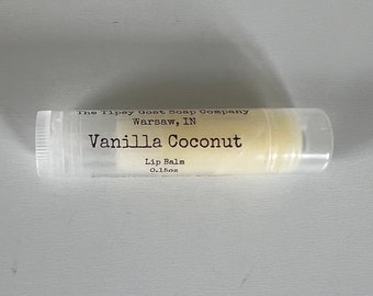 May include: A clear plastic tube of vanilla coconut lip balm from The Tipsy Goat Soap Company in Warsaw, IN. The lip balm is 0.15 oz.