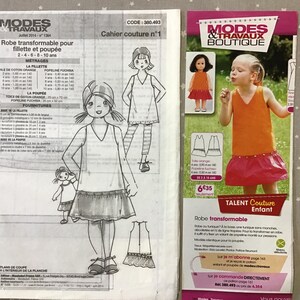 Peut inclure: Une tasse en céramique blanche avec une anse noire et le texte "But First, Coffee" en gras noir. La tasse est posée sur un fond flou, suggérant un cadre chaleureux.