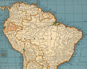 May include: A vintage map of South America with country borders and major cities labeled. The map is printed on a light blue background with brown lines and text. The map is titled "Rand McNally Popular Map of South America".