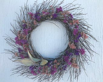 wreath with a wild blueberry twig background with statice, perovskia and a milkweed star/dried flower wreath/colorful dried flower wreath