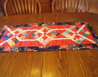 Red with diamonds with floral border