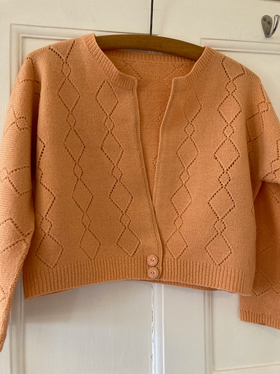 1940s hand knitted, apricot coloured cropped cardi