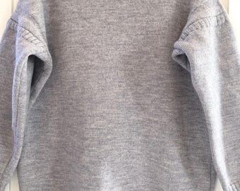 Traditional Guernsey jumper in light blueish/grey marl wool. Medium size.