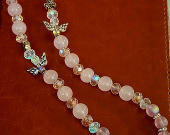 Christian prayer bead, pink with silver angels