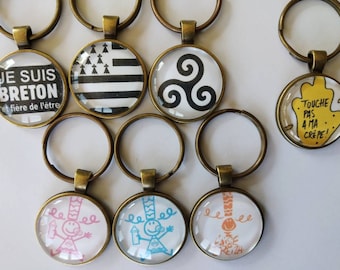 porte clé, bijou de sac personnalisé Triskel,drapeau,symbole breton,je suis fier d'être breton,touche pas à ma crèpe,cabochon en verre 25mm