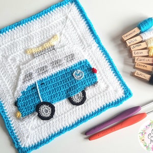 May include: A crochet square featuring a blue and white camper van with a surfboard on top. The square is surrounded by a turquoise border. The image also shows the yarn colours used in the project, along with crochet hooks.