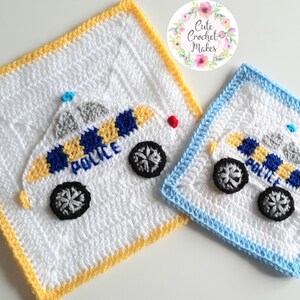 May include: Two crocheted squares with a police car design. The larger square has a yellow border and the smaller square has a blue border. Both squares are white with a blue and yellow police car design. The word "POLICE" is written on the car.