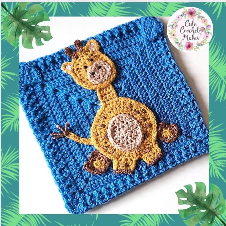 May include: A blue crocheted square with a yellow crocheted giraffe applique. The giraffe has brown spots and a brown nose.