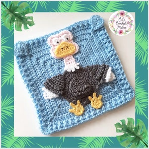 May include: A crocheted square featuring a cartoon-style ostrich with a pink head, yellow beak, and gray body. The square is light blue and has a textured stitch pattern. The image includes the text "Cute Crochet Makes".