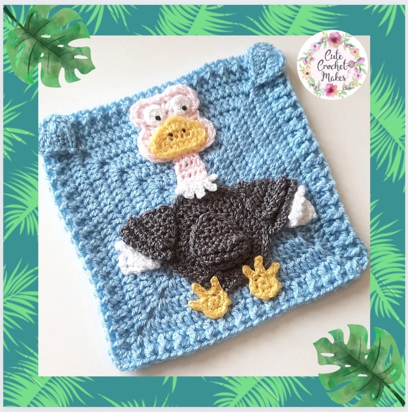 May include: A crocheted square featuring a cartoon-style ostrich with a pink head, yellow beak, and gray body. The square is light blue and has a textured stitch pattern. The image includes the text "Cute Crochet Makes".
