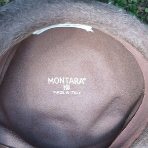 May include: The inside of a brown felt hat with a white label that reads "MONTARA&reg;" and "MADE IN ITALY".