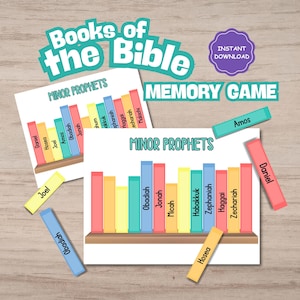 May include: A white ceramic mug with a black handle and the text "But first, coffee" in a black, handwritten-style font. The mug is on a white surface.