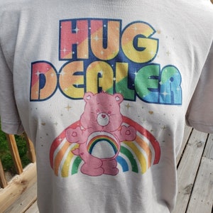 Care Bears | Hug Dealer | Tenderheart | Funshine | Grumpy | Cheer| Good Luck | Share | Laugh a lot | Birthday | Friend  Retro look T-shirt