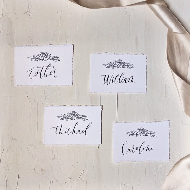 Handwritten custom modern calligraphy placecard with peony flower illustration and hand torn deckled edges wedding escort name place cards
