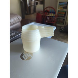 Set di 5 misurini impilabili Tupperware vintage, bianchi trasparenti.