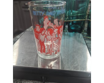 Tarro de cristal para mermelada de Archie Comics de 1973 con Betty y Verónica dando una fiesta.