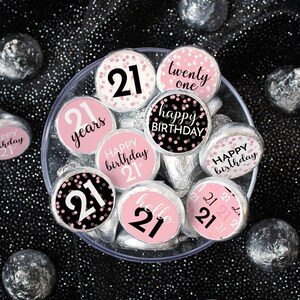 May include: Pink and black 21st birthday party favor stickers with confetti and text that says "happy birthday", "21 years", "twenty one", "hello 21", and "happy birthday 21st".