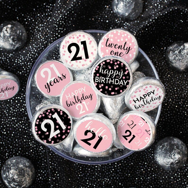 May include: Pink and black 21st birthday party favor stickers with confetti and text that says "happy birthday", "21 years", "twenty one", "hello 21", and "happy birthday 21st".