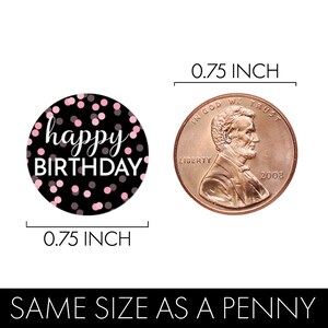 May include: Black and pink confetti circle sticker with the text "happy birthday" in white. The sticker is 0.75 inches in diameter, the same size as a penny.