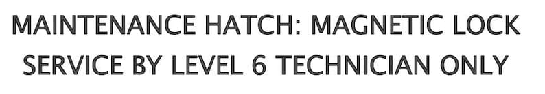 May include: Black and white text on a white background. The text reads "MAINTENANCE HATCH: MAGNETIC LOCK SERVICE BY LEVEL 6 TECHNICIAN ONLY".