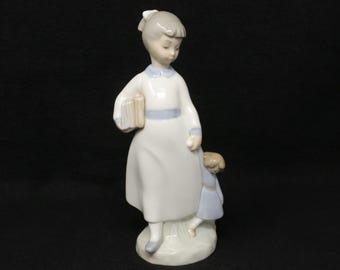 MINT 7 1/4" Zaphir by Lladro Girl with Books and Baby Doll, retired porcelain school girl figurine, made in Spain, Lladro gift