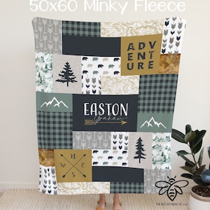 May include: A 50x60 inch minky fleece blanket with a patchwork design featuring a compass, mountains, trees, arrows, bears, and the text "Adventure" and "Easton Graham".