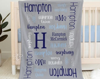 May include: A gray minky fleece blanket with the name "Hampton" repeated in various sizes and colors, including blue and navy. The blanket also features the letter "H" in navy blue and the text "30x40" Minky Fleece".