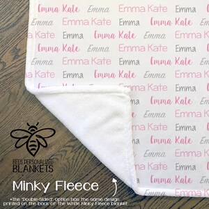 May include: White minky fleece blanket with a pink and gray pattern of the names "Emma Kate" repeated. The blanket is folded in half, revealing the white side. The text "Bees Personalized Blankets" and "Minky Fleece" is printed on the bottom of the image.
