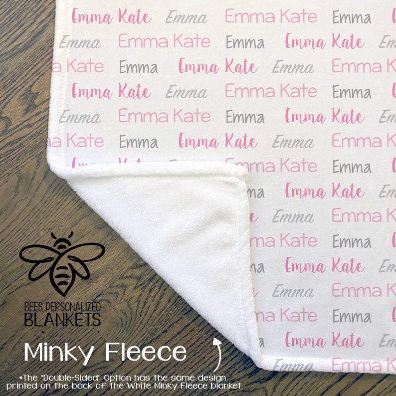 May include: White minky fleece blanket with a pink and gray pattern of the names "Emma Kate" repeated. The blanket is folded in half, revealing the white side. The text "Bees Personalized Blankets" and "Minky Fleece" is printed on the bottom of the image.