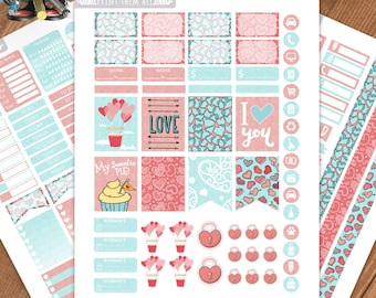 May include: A printable sheet of Valentine's Day themed stickers with various designs including hearts, balloons, cupcakes, locks, and text such as "Love" and "I love you".