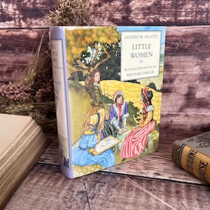 Mujercitas de Louisa May Alcott, 1999. Pequeño libro infantil con sobrecubierta. Ilustrado por Michael Hague. Publicado por Colour Library.