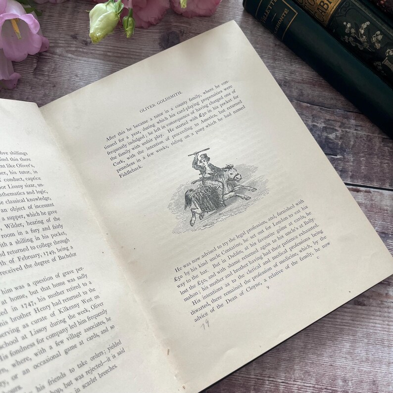 May include: A black and white illustration of a man riding a horse. The man is holding a stick in his right hand and is wearing a hat. The horse is running to the right. The illustration is from a book about the life of Oliver Goldsmith.