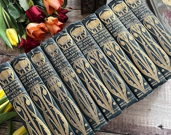 May include: A set of ten black hardback books with gold lettering and illustrations. The books are titled "The Works of Edgar Allan Poe" and each volume contains a different collection of his works, including tales, criticism, poems, and Eureka.