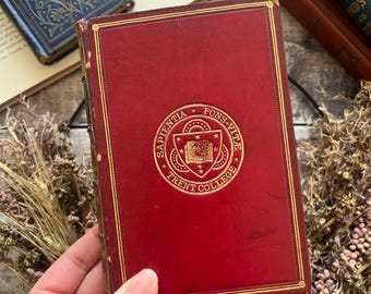 1898 En bok med gyllene gärningar av Charlotte Yonge; Helläder