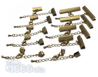 May include: A set of 15 gold-toned metal clasps with chains. The clasps are rectangular and have a textured surface. The chains are delicate and have a lobster claw clasp.